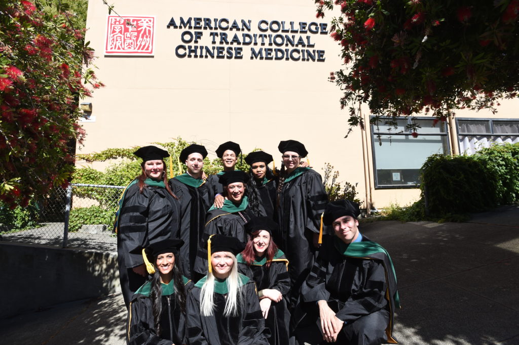 Class of 2017 graduates in front of ACTCM Building